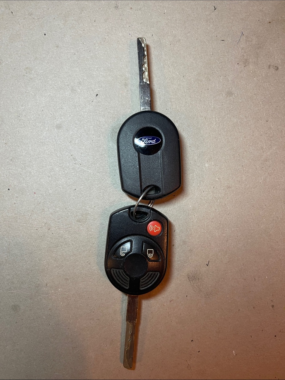 Ford Escape Black Key with Black Remote and Red Panic Button 
I have two.
